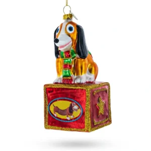 Playful Toy Dog On Festive Red Box - Blown Glass Christmas Ornament - CaringForTots - Professional Baby and Children's Products | Caring for Growth, Caring for Every Moment* Christmas Tree Ornaments